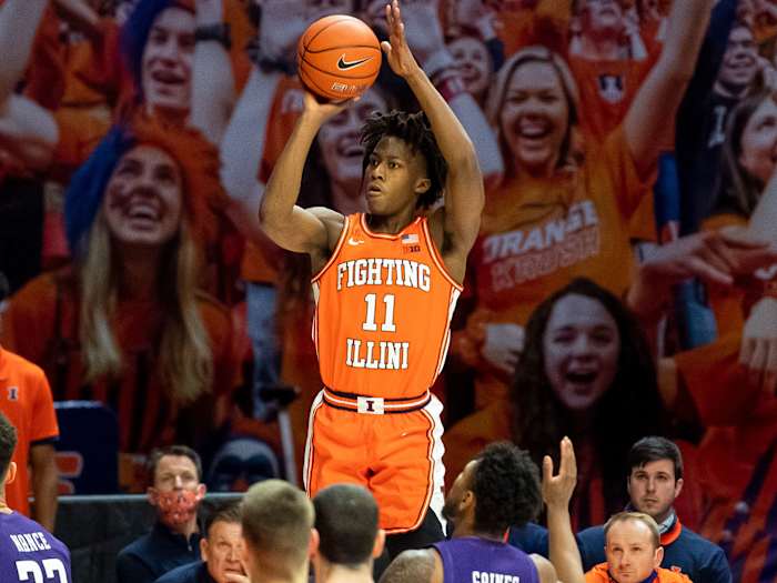 Illinois guard Ayo Dosunmu rises for a three-point shot